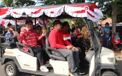 Bupati Beltim Turun Langsung Ikut Pawai Pembangunan